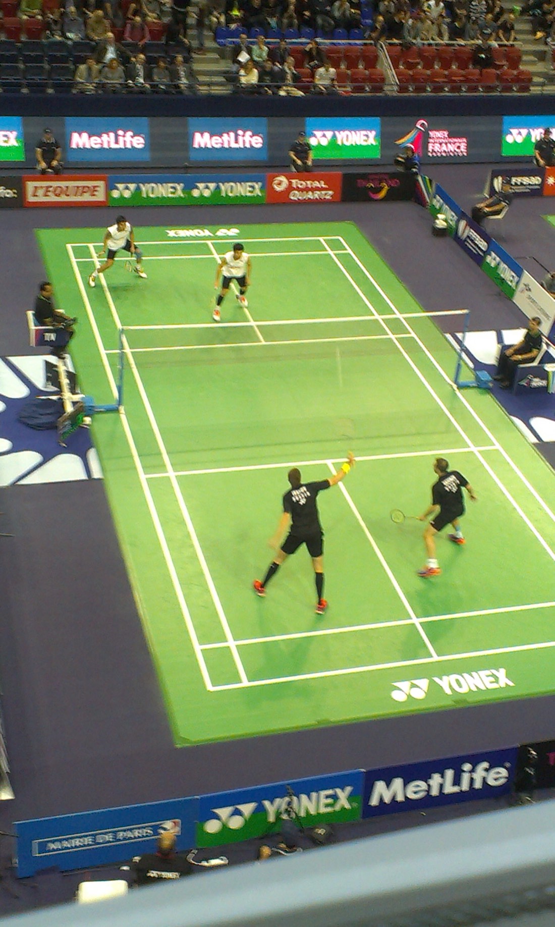 Doubles pair at the net during a competition match